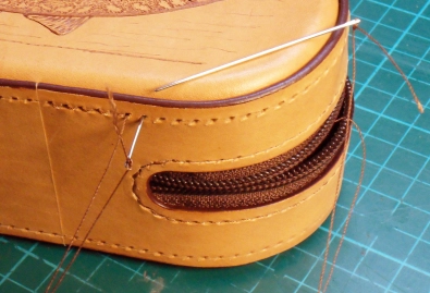 Sewing the parts together with a saddle stitch Sewing the parts together with a saddle stitch