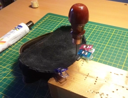 Making the stitching holes with an awl Making the stitching holes with an awl